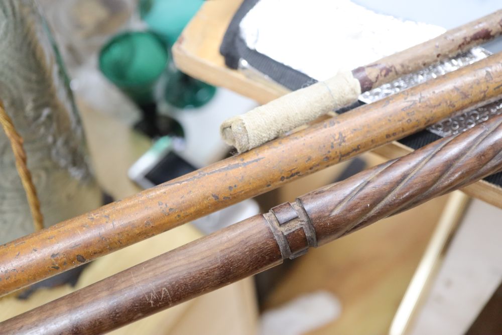 Two walking canes, one with horn handle, the other silver mounted handle, together with a riding crop